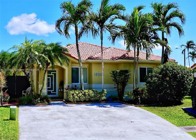 15132 SW 140th Ter, Miami, FL 33196 - view of front facade with stucco siding and a tiled roof