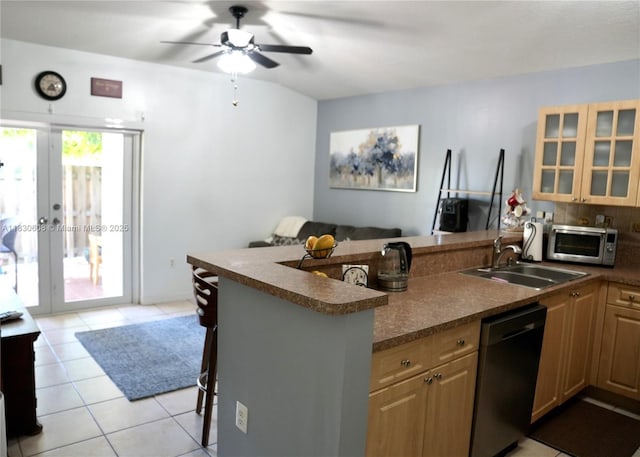 15132 SW 140th Ter, Miami, FL 33196 - kitchen with appliances with stainless steel finishes, a peninsula, dark countertops, and ceiling fan