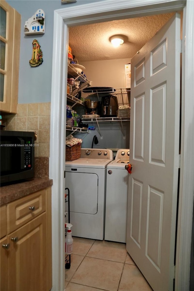 15132 SW 140th Ter, Miami, FL 33196 - laundry area with washing machine and dryer, light tile patterned floors, and a textured ceiling