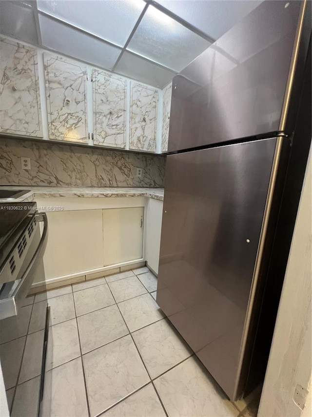 5050 NW 7th St Unit 709, Miami, FL 33126 - kitchen view of freestanding refrigerator and light countertops