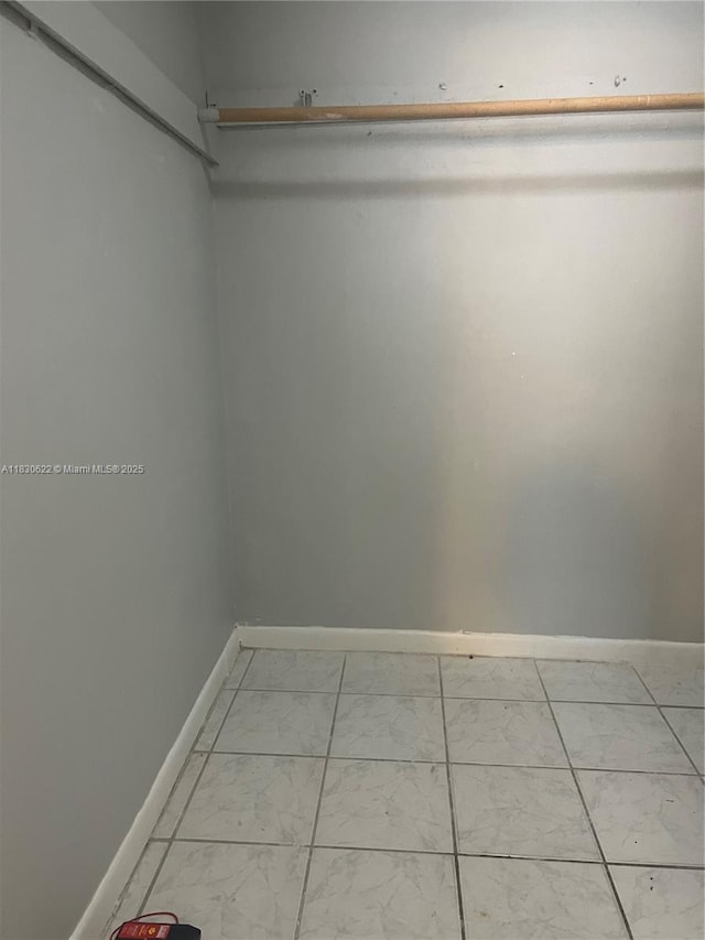 5050 NW 7th St Unit 709, Miami, FL 33126 - spacious closet with light marble finish floors
