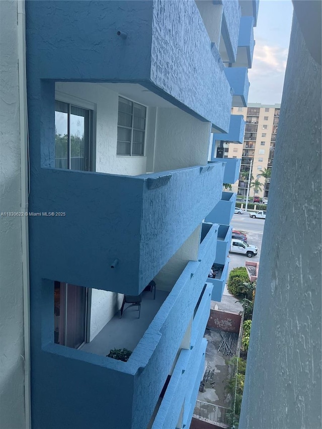 5050 NW 7th St Unit 709, Miami, FL 33126 - view of property exterior with a balcony and stucco siding