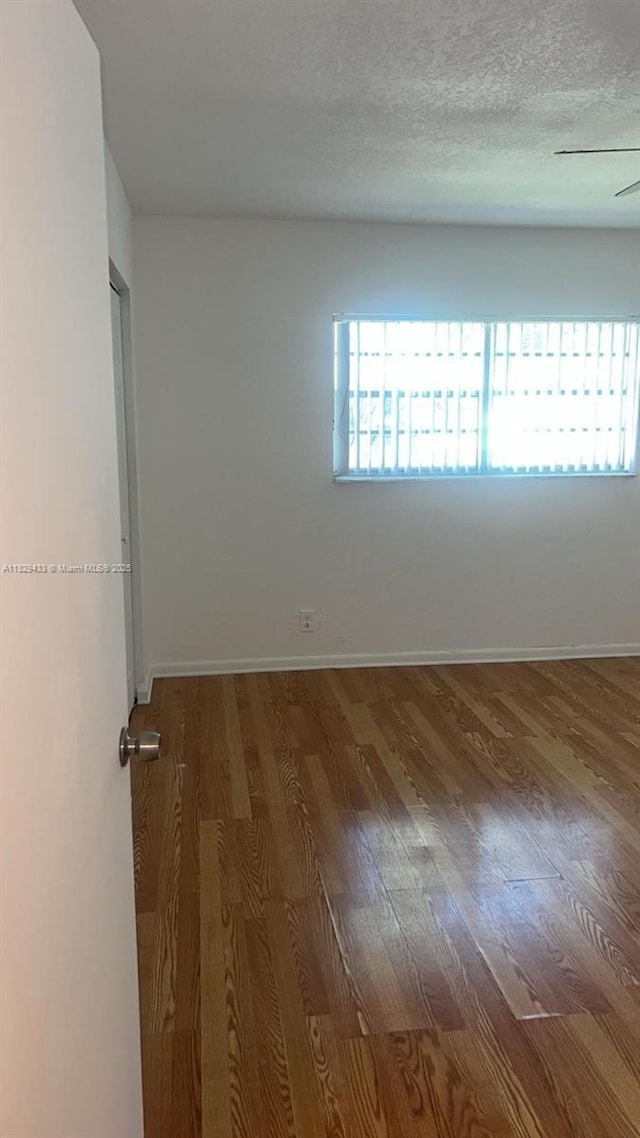 4820 NW 9th Dr Unit 4820, Plantation, FL 33317 - spare room featuring wood finished floors and baseboards