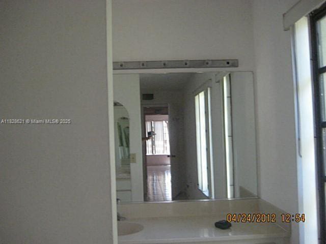 9015 SW 125th Ave Unit N406, Miami, FL 33186 - hallway featuring arched walkways