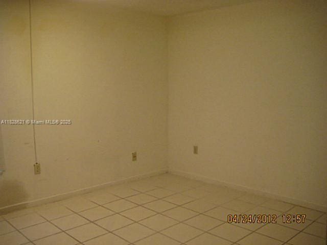 9015 SW 125th Ave Unit N406, Miami, FL 33186 - empty room with light tile patterned floors