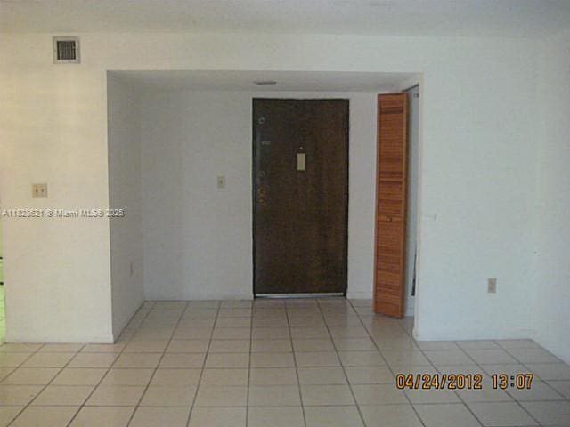 9015 SW 125th Ave Unit N406, Miami, FL 33186 - spare room with light tile patterned floors