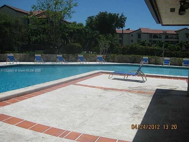 9015 SW 125th Ave Unit N406, Miami, FL 33186 - community pool with a patio