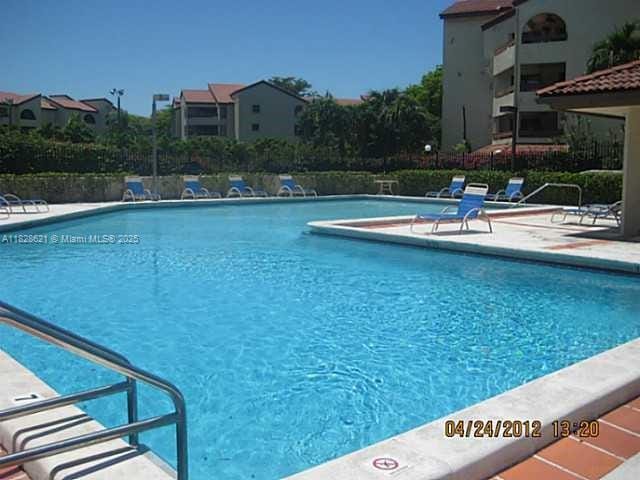 9015 SW 125th Ave Unit N406, Miami, FL 33186 - community pool featuring a patio