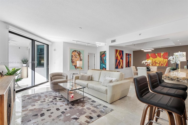 110 Washington Ave Unit 1608, Miami Beach, FL 33139 - living area with light tile patterned floors and a textured ceiling