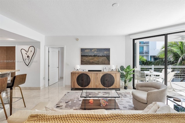 110 Washington Ave Unit 1608, Miami Beach, FL 33139 - living area with marble finish floors and a textured ceiling