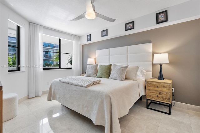 110 Washington Ave Unit 1608, Miami Beach, FL 33139 - bedroom featuring light tile patterned floors and a ceiling fan