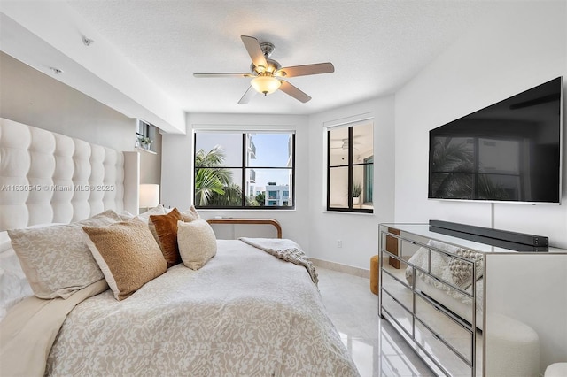 110 Washington Ave Unit 1608, Miami Beach, FL 33139 - tiled bedroom with a textured ceiling and ceiling fan
