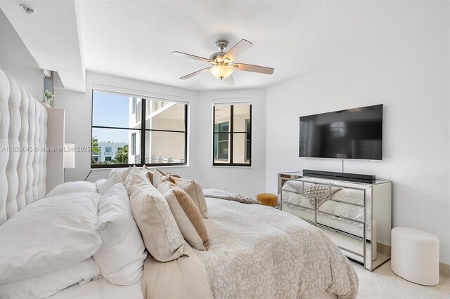 110 Washington Ave Unit 1608, Miami Beach, FL 33139 - bedroom featuring light tile patterned floors and a ceiling fan