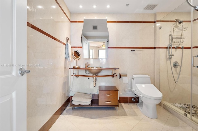 110 Washington Ave Unit 1608, Miami Beach, FL 33139 - bathroom with a shower stall, ceiling fan, and tile walls