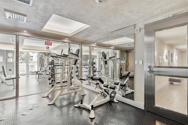110 Washington Ave Unit 1608, Miami Beach, FL 33139 - gym featuring a textured ceiling
