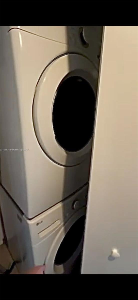45 SW 9th St Unit 1906, Miami, FL 33130 - laundry area featuring stacked washer / drying machine