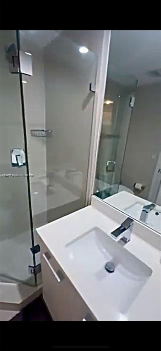 45 SW 9th St Unit 1906, Miami, FL 33130 - bathroom with a stall shower and vanity