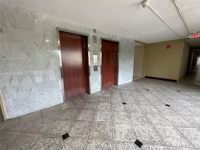 6940 Miami Gardens Dr Unit 1-329, Hialeah, FL 33015 - unfurnished room with elevator and a textured ceiling