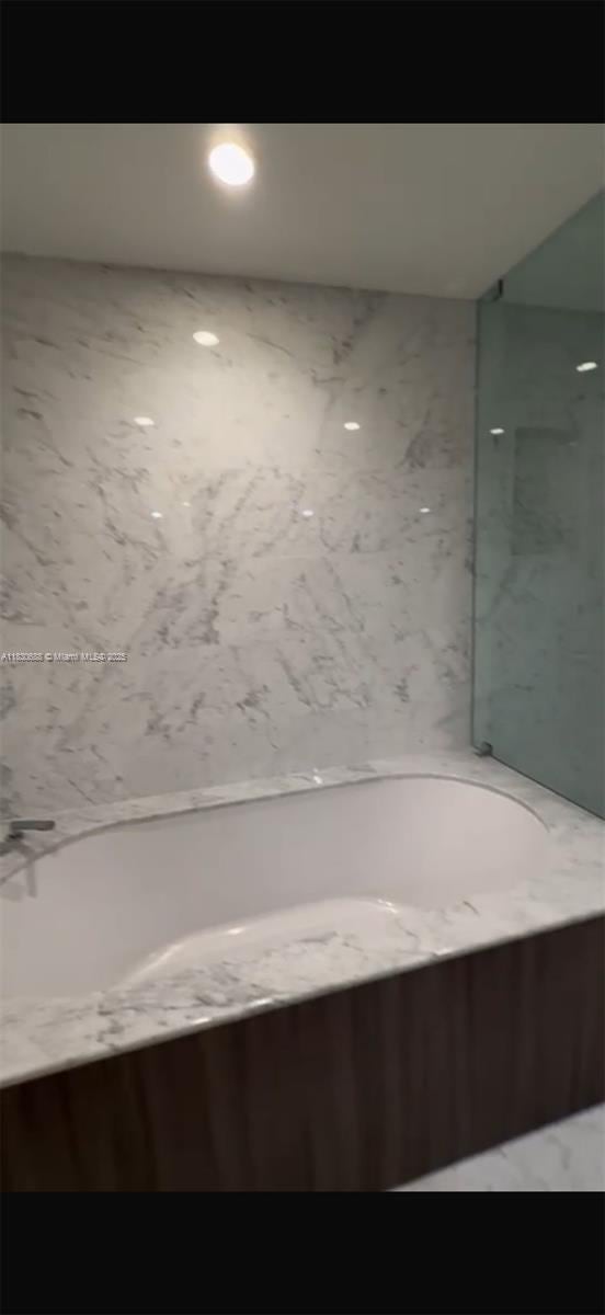 1000 Brickell Plz Unit 2008, Miami, FL 33131 - full bathroom featuring a garden tub