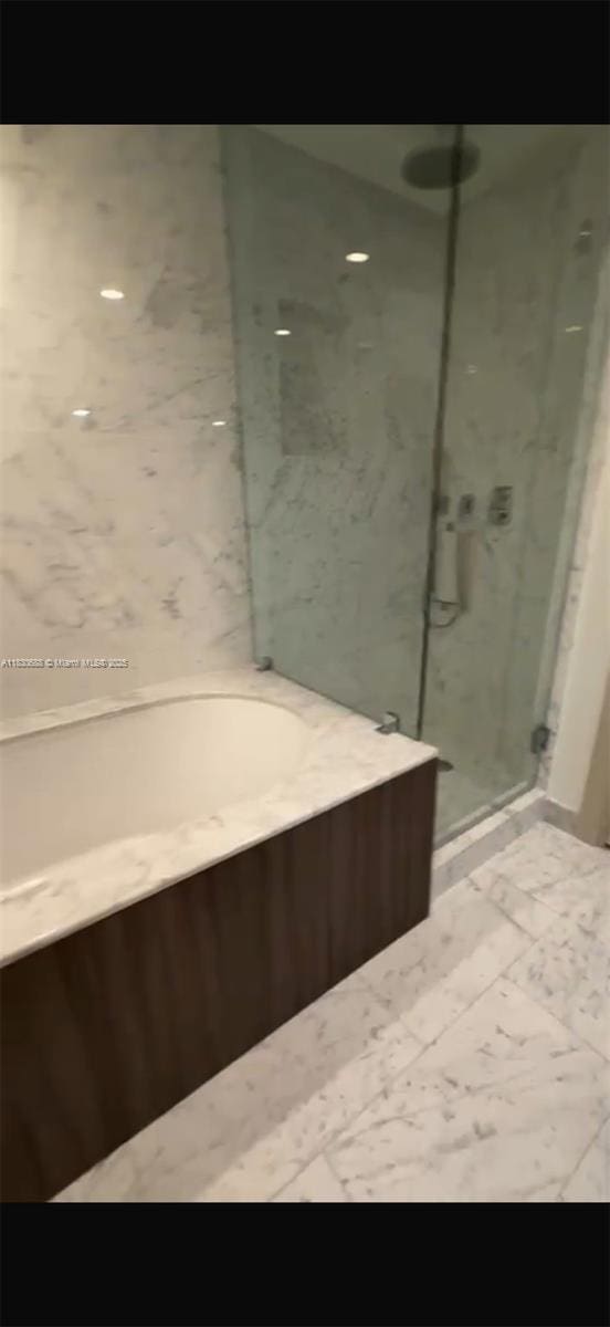 1000 Brickell Plz Unit 2008, Miami, FL 33131 - full bath with a stall shower and a garden tub