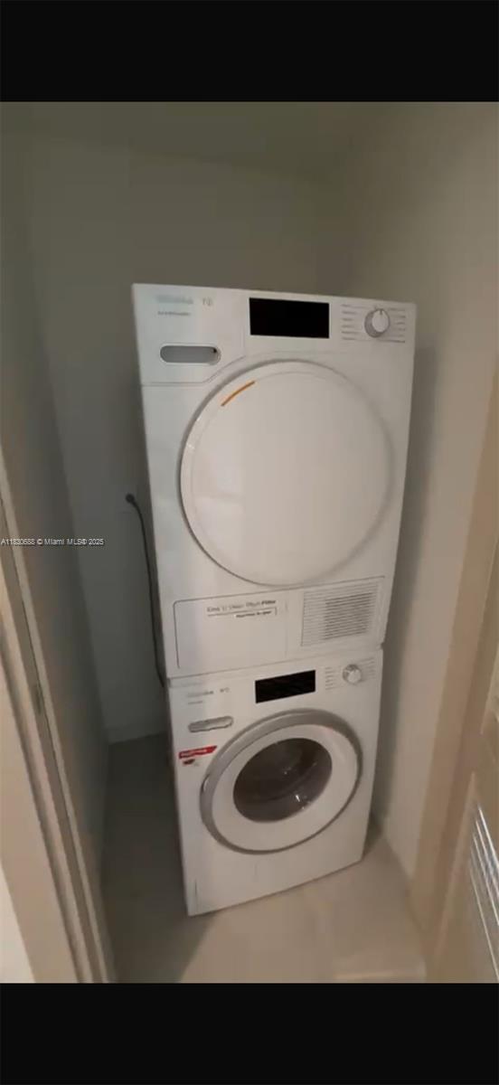 1000 Brickell Plz Unit 2008, Miami, FL 33131 - laundry area with stacked washer and clothes dryer