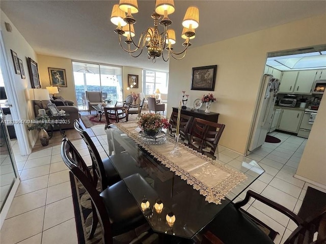 1200 Saint Charles Pl Unit 708, Pembroke Pines, FL 33026 - dining area with light tile patterned floors and a chandelier