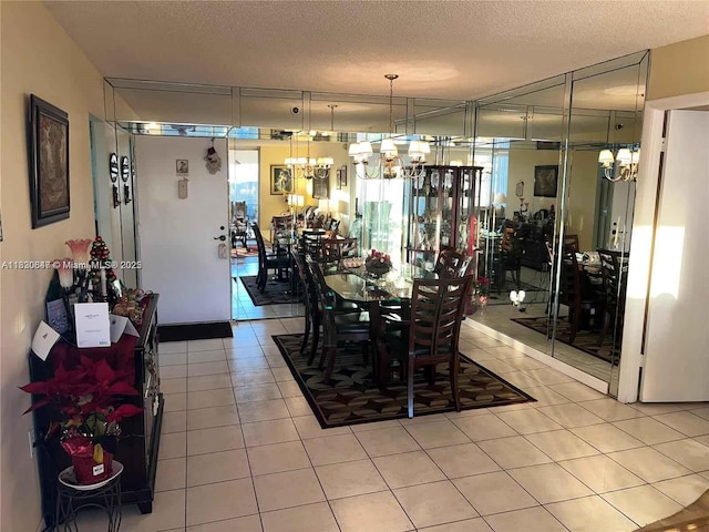 1200 Saint Charles Pl Unit 708, Pembroke Pines, FL 33026 - dining area with a chandelier, light tile patterned flooring, and a textured ceiling