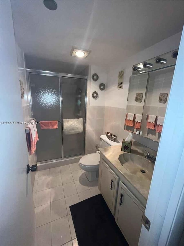 1200 Saint Charles Pl Unit 708, Pembroke Pines, FL 33026 - bathroom featuring tile patterned floors, vanity, a stall shower, and tile walls