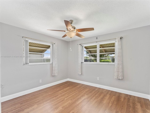 2991 NW 1st Dr, Pompano Beach, FL 33064 - unfurnished room with ceiling fan, wood finished floors, and a textured ceiling