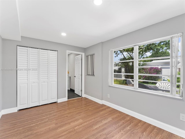 2991 NW 1st Dr, Pompano Beach, FL 33064 - unfurnished bedroom featuring light wood-style flooring and recessed lighting