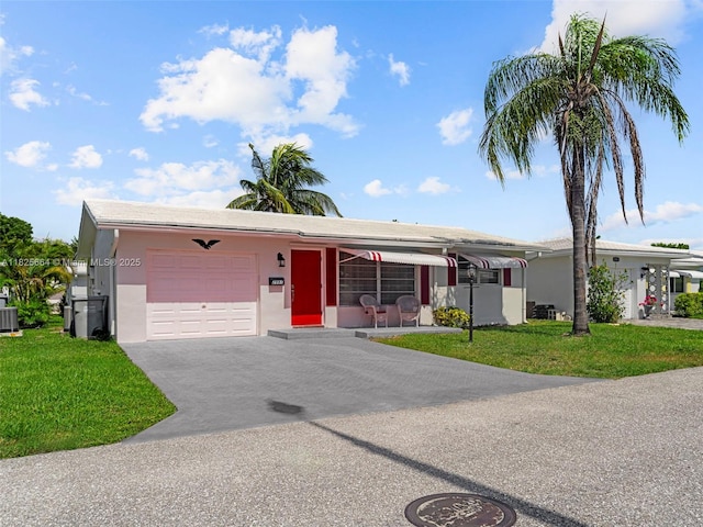 2991 NW 1st Dr, Pompano Beach, FL 33064 - single story home featuring an attached garage, a front lawn, asphalt driveway, and stucco siding