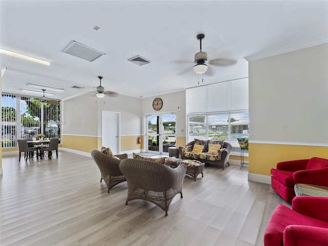 2991 NW 1st Dr, Pompano Beach, FL 33064 - living room featuring ceiling fan, light wood-style floors, plenty of natural light, and crown molding