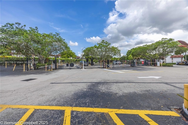 3531 Inverrary Dr Unit 101, Lauderhill, FL 33319 - view of asphalt road with a gate and a gated entry