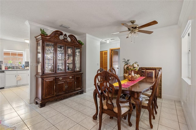 5443 SW 143rd Ct, Miami, FL 33175 - dining space featuring a ceiling fan, crown molding, light tile patterned floors, and a textured ceiling