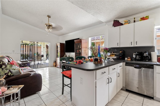 5443 SW 143rd Ct, Miami, FL 33175 - kitchen with stainless steel dishwasher, open floor plan, a peninsula, a textured ceiling, and vaulted ceiling
