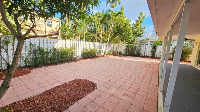 1336 NW 129th Way, Sunrise, FL 33323 - fenced backyard with a patio area