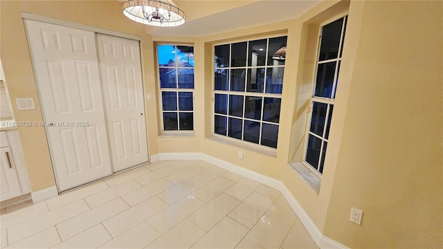 1336 NW 129th Way, Sunrise, FL 33323 - unfurnished dining area featuring a chandelier and tile patterned flooring