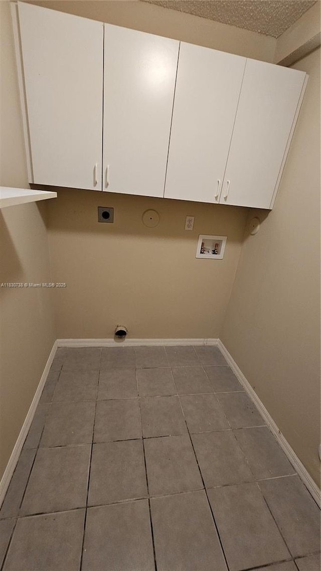 1336 NW 129th Way, Sunrise, FL 33323 - washroom with hookup for an electric dryer, washer hookup, cabinet space, and tile patterned floors