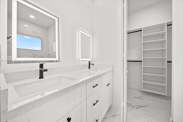 1212 Edelweiss St E, Lehigh Acres, FL 33974 - bathroom with marble finish flooring, double vanity, a walk in closet, and recessed lighting