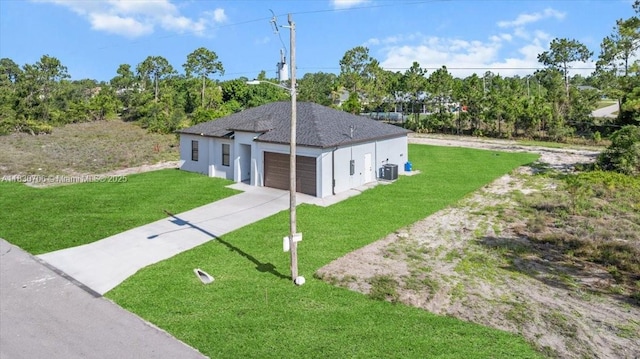 1212 Edelweiss St E, Lehigh Acres, FL 33974 - single story home featuring a front lawn, driveway, stucco siding, and a garage