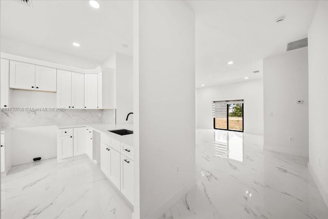 1212 Edelweiss St E, Lehigh Acres, FL 33974 - laundry room featuring light marble finish flooring and recessed lighting