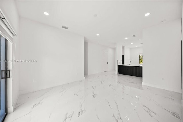 1212 Edelweiss St E, Lehigh Acres, FL 33974 - unfurnished living room featuring recessed lighting and light marble finish floors
