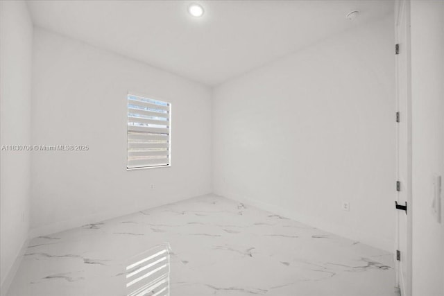 1212 Edelweiss St E, Lehigh Acres, FL 33974 - unfurnished room with marble finish flooring and recessed lighting