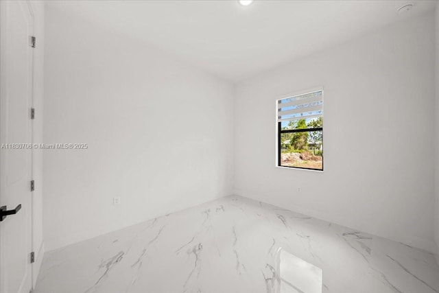 1212 Edelweiss St E, Lehigh Acres, FL 33974 - spare room featuring marble tiled floors, recessed lighting, and a smoke detector