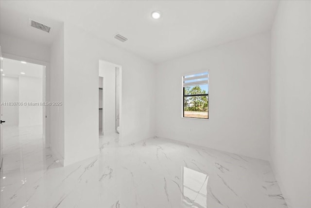 1212 Edelweiss St E, Lehigh Acres, FL 33974 - spare room with marble tiled floors and recessed lighting