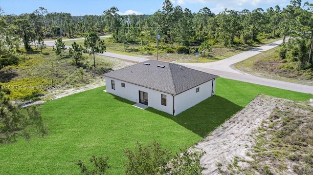 1212 Edelweiss St E, Lehigh Acres, FL 33974 - view from above of property with a heavily wooded area