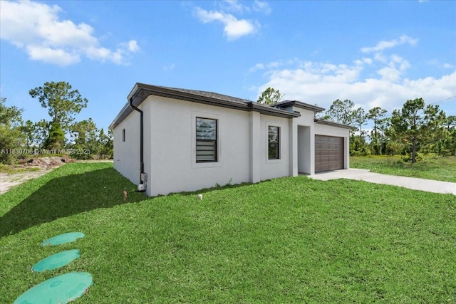 1212 Edelweiss St E, Lehigh Acres, FL 33974 - view of front of home featuring a garage, driveway, and a front lawn