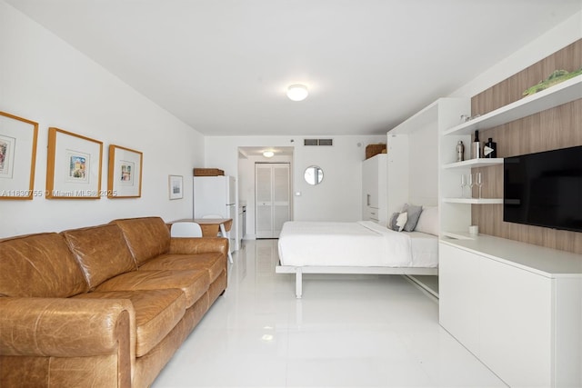 791 Crandon Blvd Unit C.851, Key Biscayne, FL 33149 - bedroom featuring freestanding refrigerator and light tile patterned floors