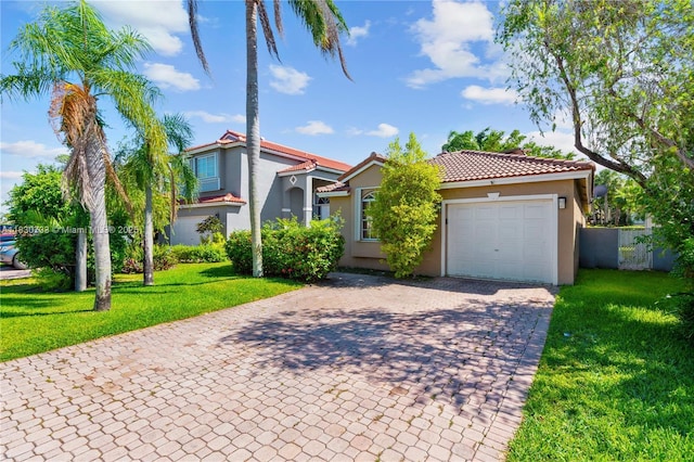 324 NW 107th Ave, Pembroke Pines, FL 33026 - mediterranean / spanish-style house featuring stucco siding, decorative driveway, a garage, a front yard, and a tiled roof