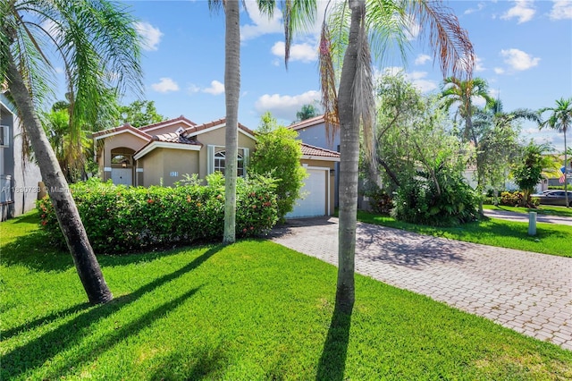 324 NW 107th Ave, Pembroke Pines, FL 33026 - view of front facade with driveway, a tile roof, a front yard, and stucco siding